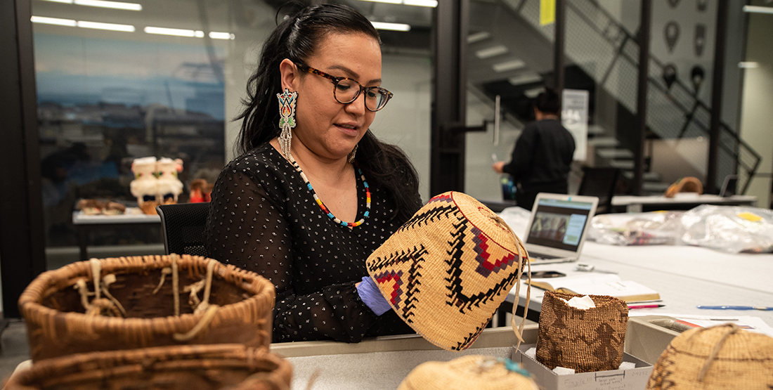 a woman examines several baskets