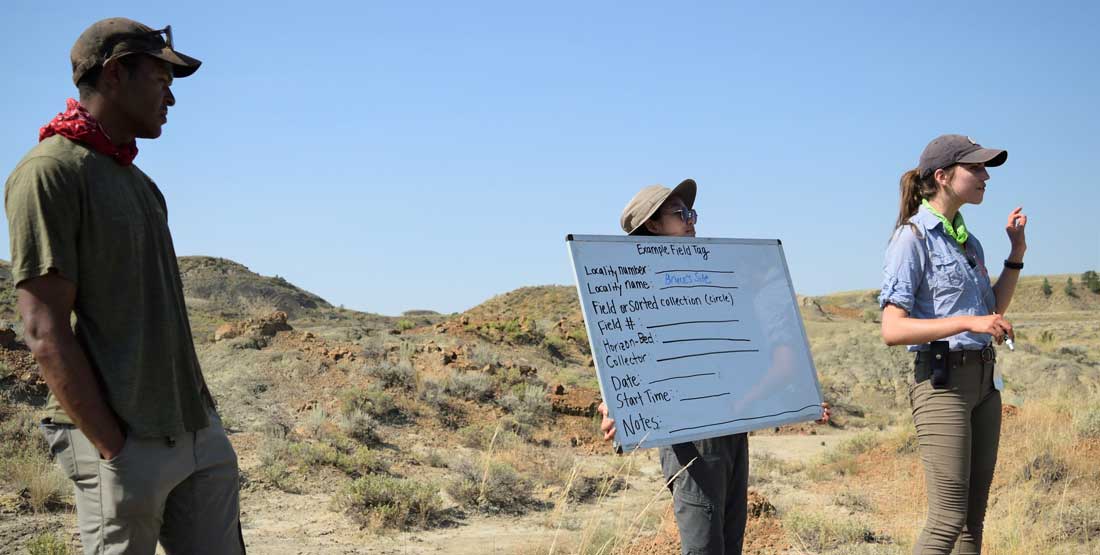 DIG Instructor Kirsten Meltesen and Isiah Newbins teach participants how to fill in field tag data before they start collecting.