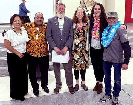 a group of people pose for a photo