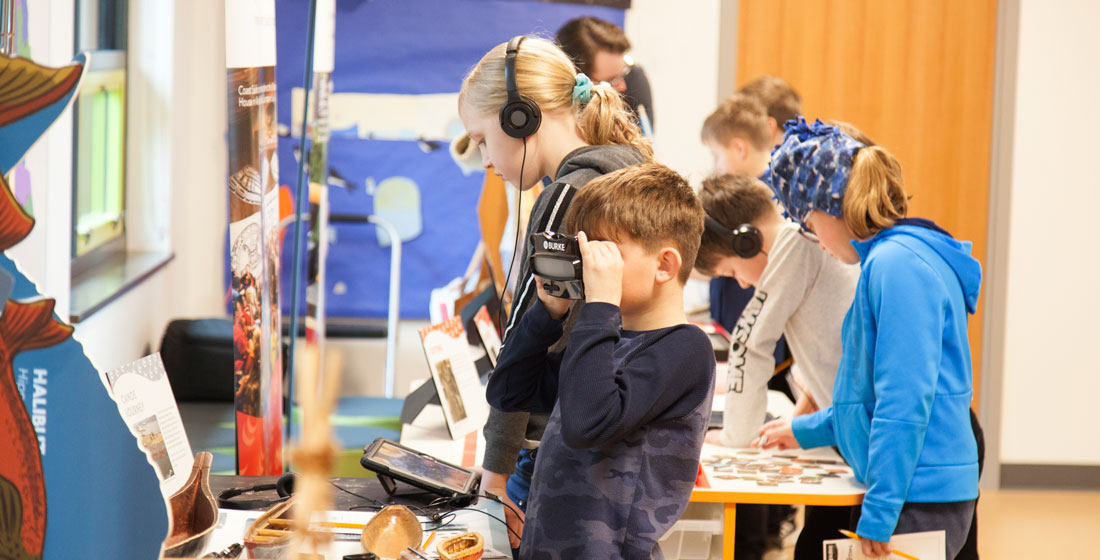 students interact with the Living Traditions BurkeMobile program