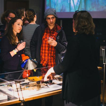 visitors learn about a specimen