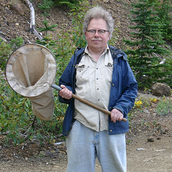 rod crawford in the field holding a catching net